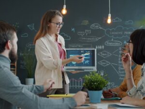 Woman presenting a business strategy to colleagues