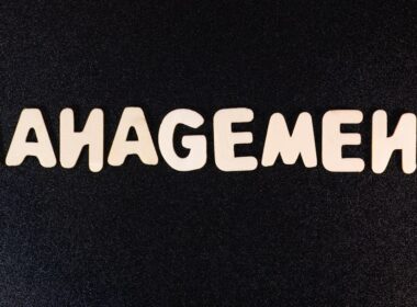 the word management written in white letters on a black background