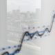 City skyline reflected on a graph