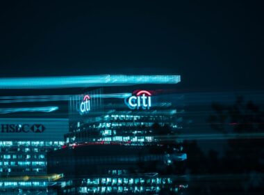 city buildings with lights during night time