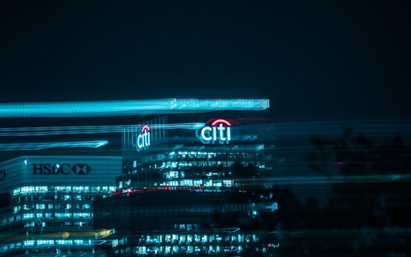 city buildings with lights during night time