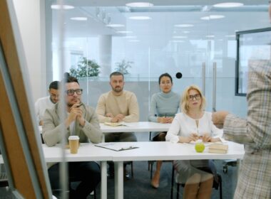 Business people attending a presentation in a modern office.