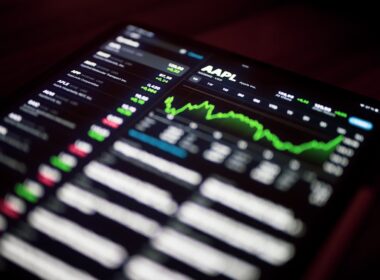 a close up of a cell phone with a stock chart on it