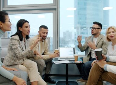 Diverse group of people in a modern office meeting.