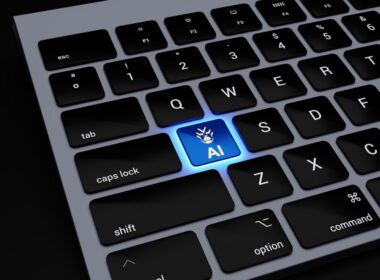 a close up of a keyboard with a blue light on it