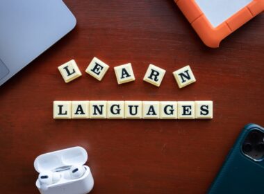 the word learn languages spelled out of scrabble tiles